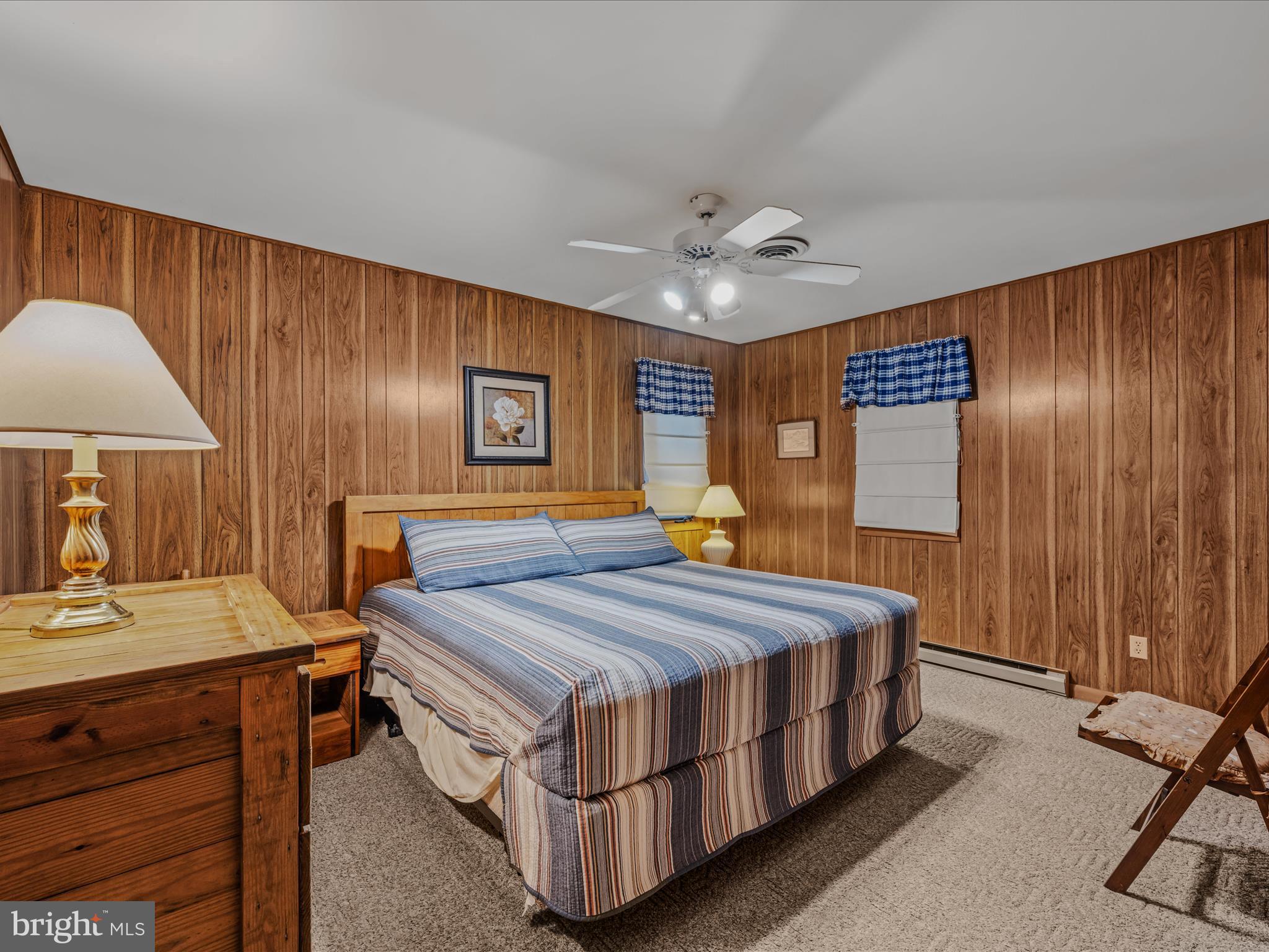 35 Warbler's Way Berkeley Springs, WV 25411 - Photo 18 of 54 a bed room with a bed and a table