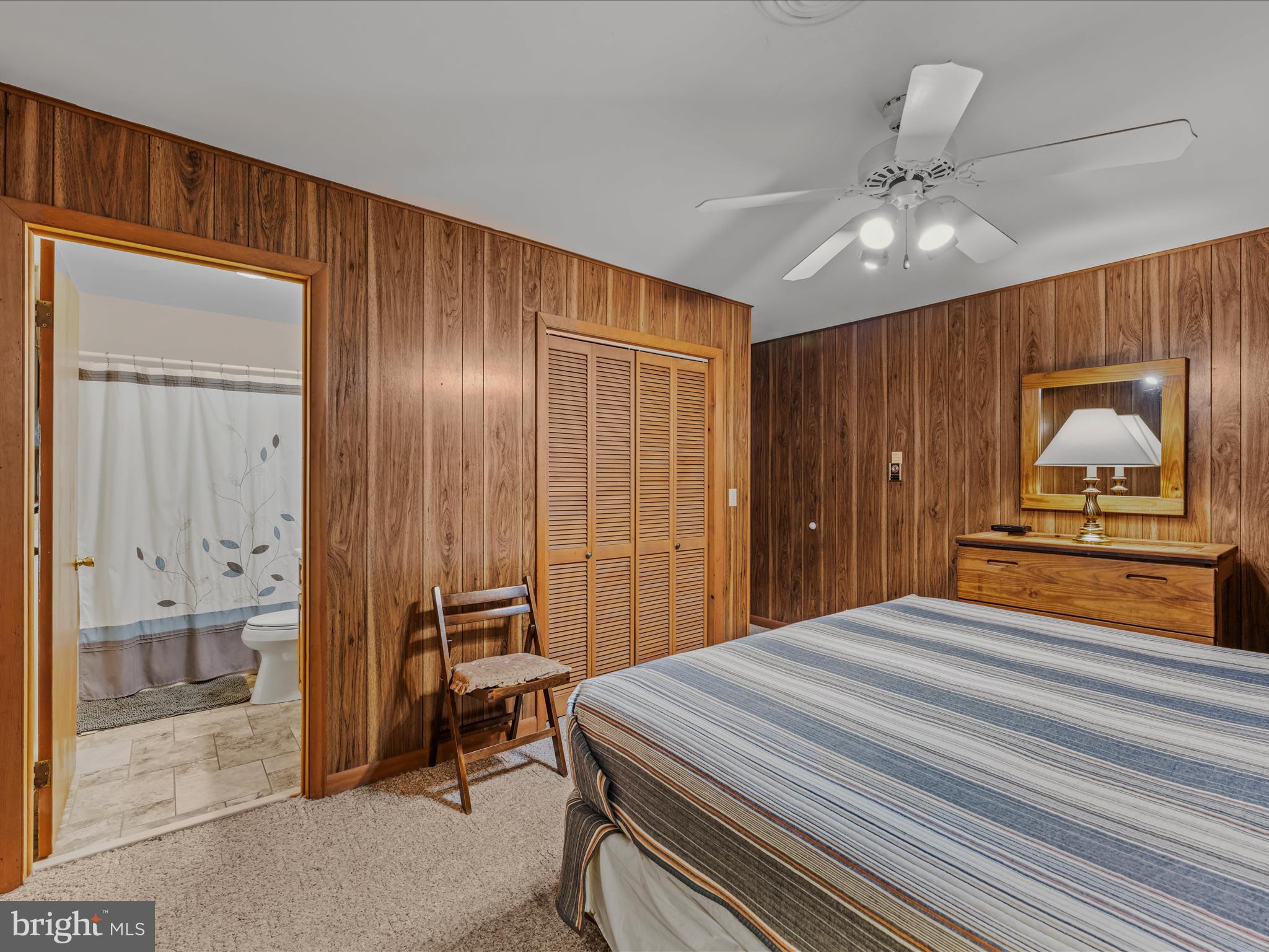 35 Warbler's Way Berkeley Springs, WV 25411 - Photo 19 of 54 a bedroom with a bed and a large mirror