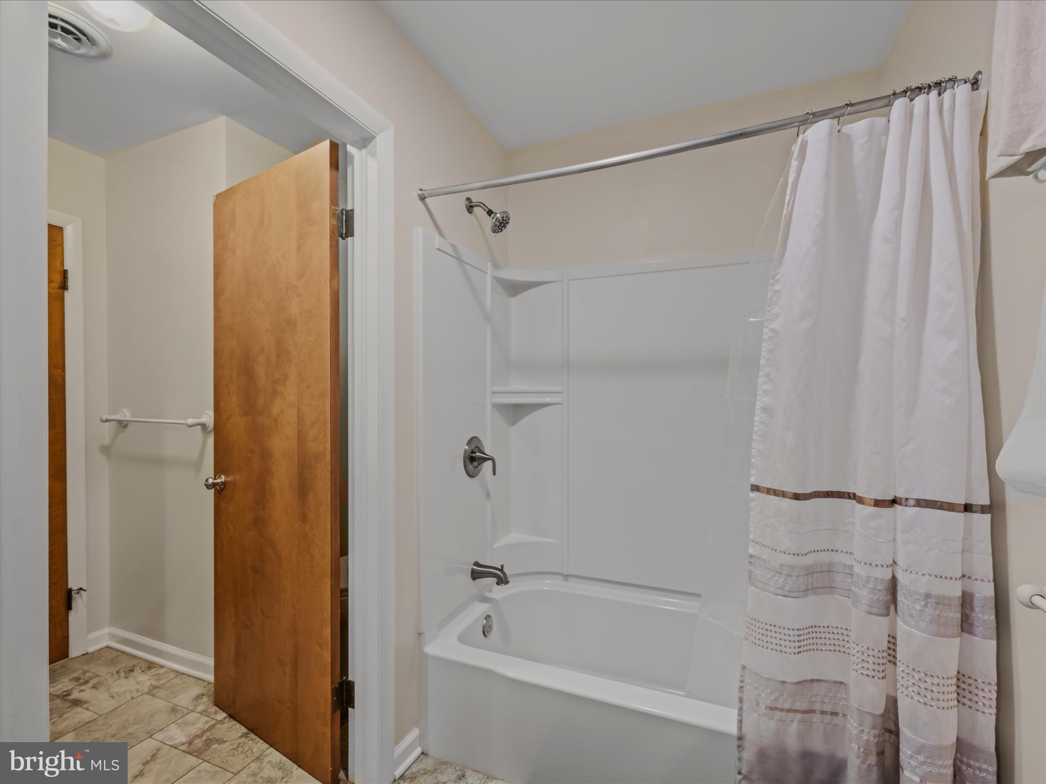35 Warbler's Way Berkeley Springs, WV 25411 - Photo 23 of 54 a bathroom with a shower and a bath tub
