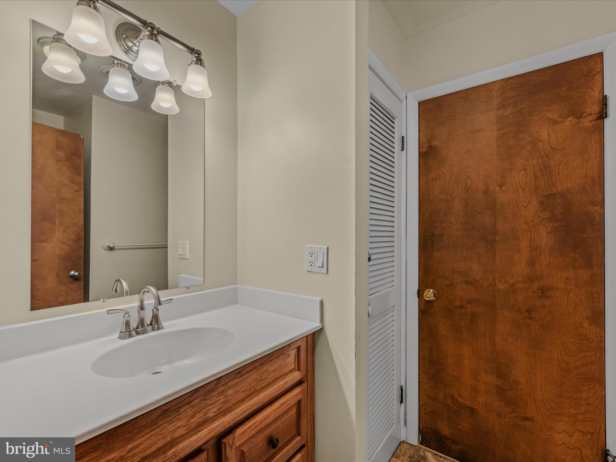 35 Warbler's Way Berkeley Springs, WV 25411 - Photo 24 of 54 a bathroom with a sink and a mirror