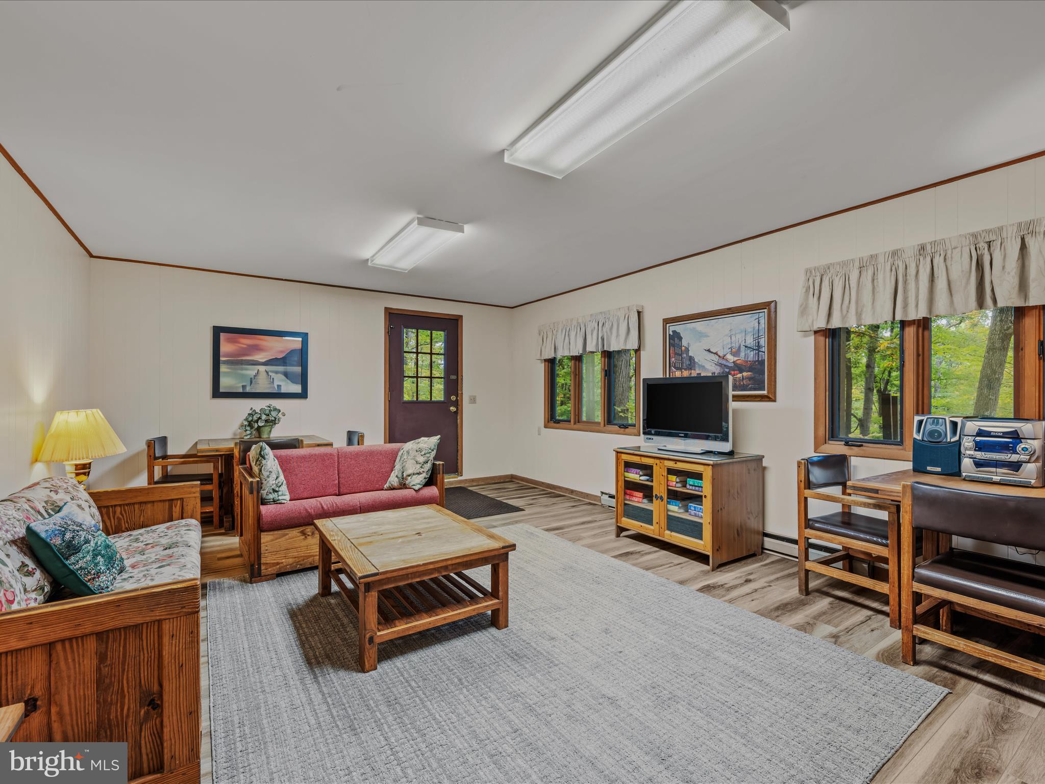 35 Warbler's Way Berkeley Springs, WV 25411 - Photo 25 of 54 a living room with furniture and a flat screen tv