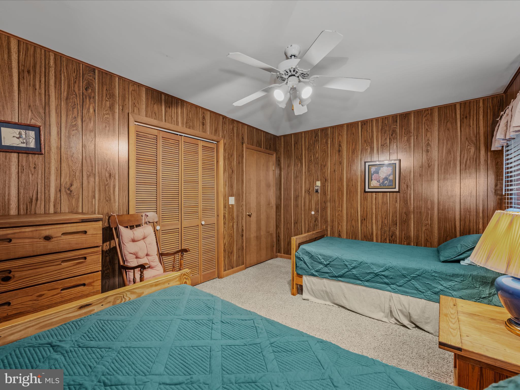 35 Warbler's Way Berkeley Springs, WV 25411 - Photo 29 of 54 a spacious bedroom with a bed and a chandelier