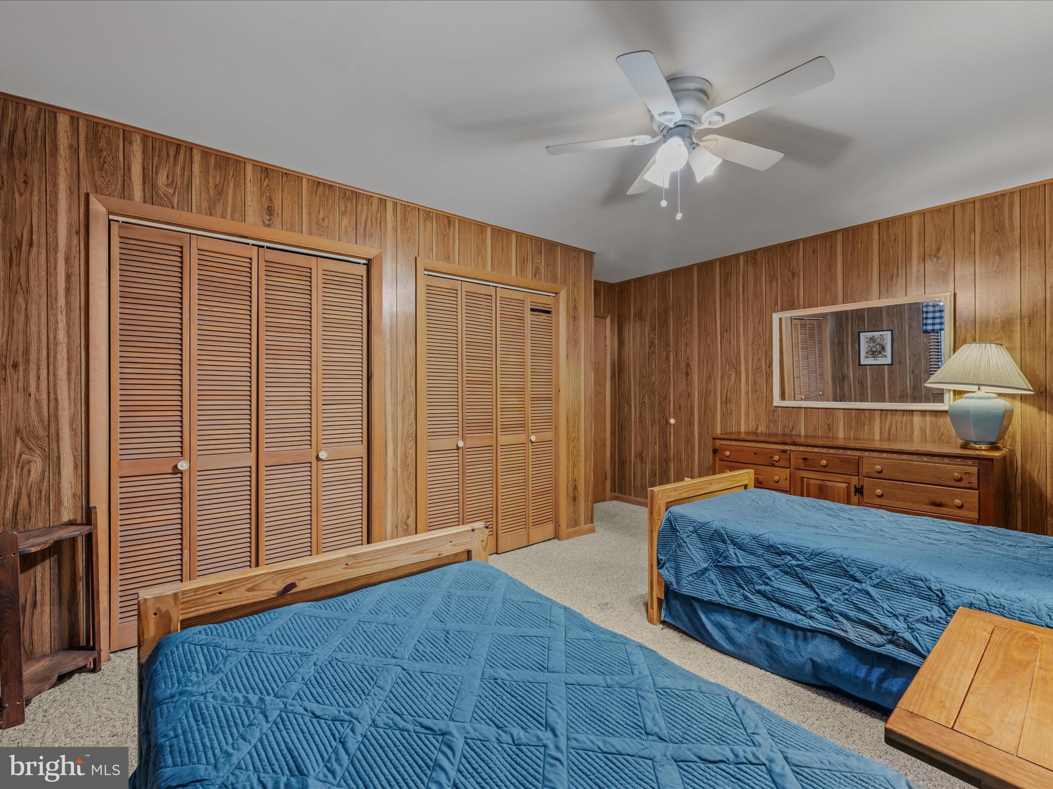 35 Warbler's Way Berkeley Springs, WV 25411 - Photo 31 of 54 a bedroom with a large bed and a chandelier
