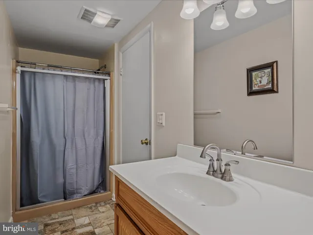 a bedroom with two beds and painted walls