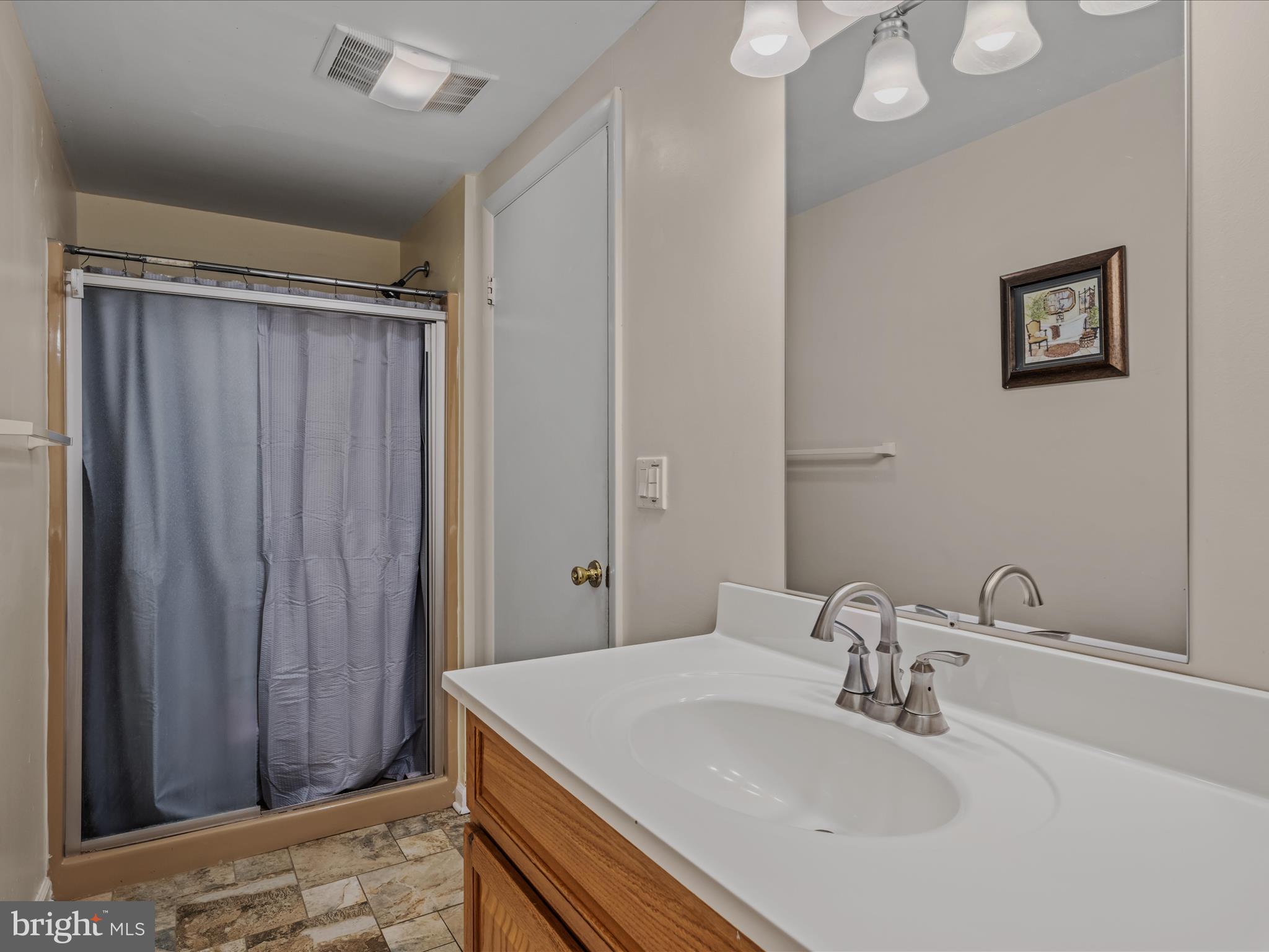 35 Warbler's Way Berkeley Springs, WV 25411 - Photo 32 of 54 a bathroom with a sink and a mirror
