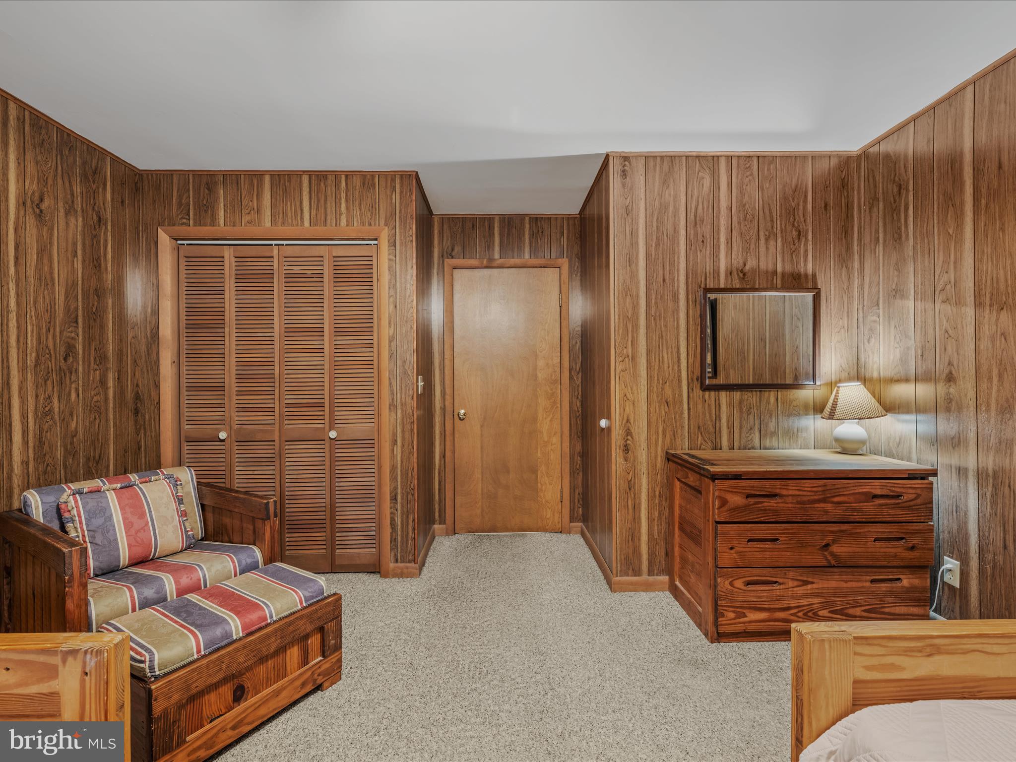 35 Warbler's Way Berkeley Springs, WV 25411 - Photo 34 of 54 a bedroom with furniture and wooden floor