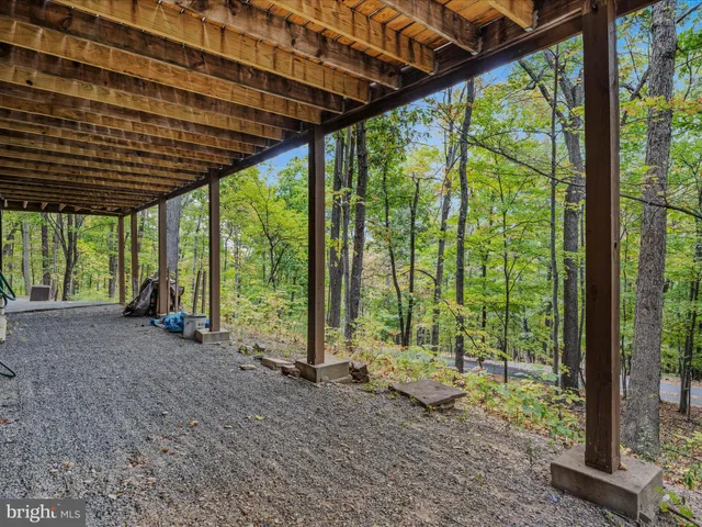front view of a house with a tree