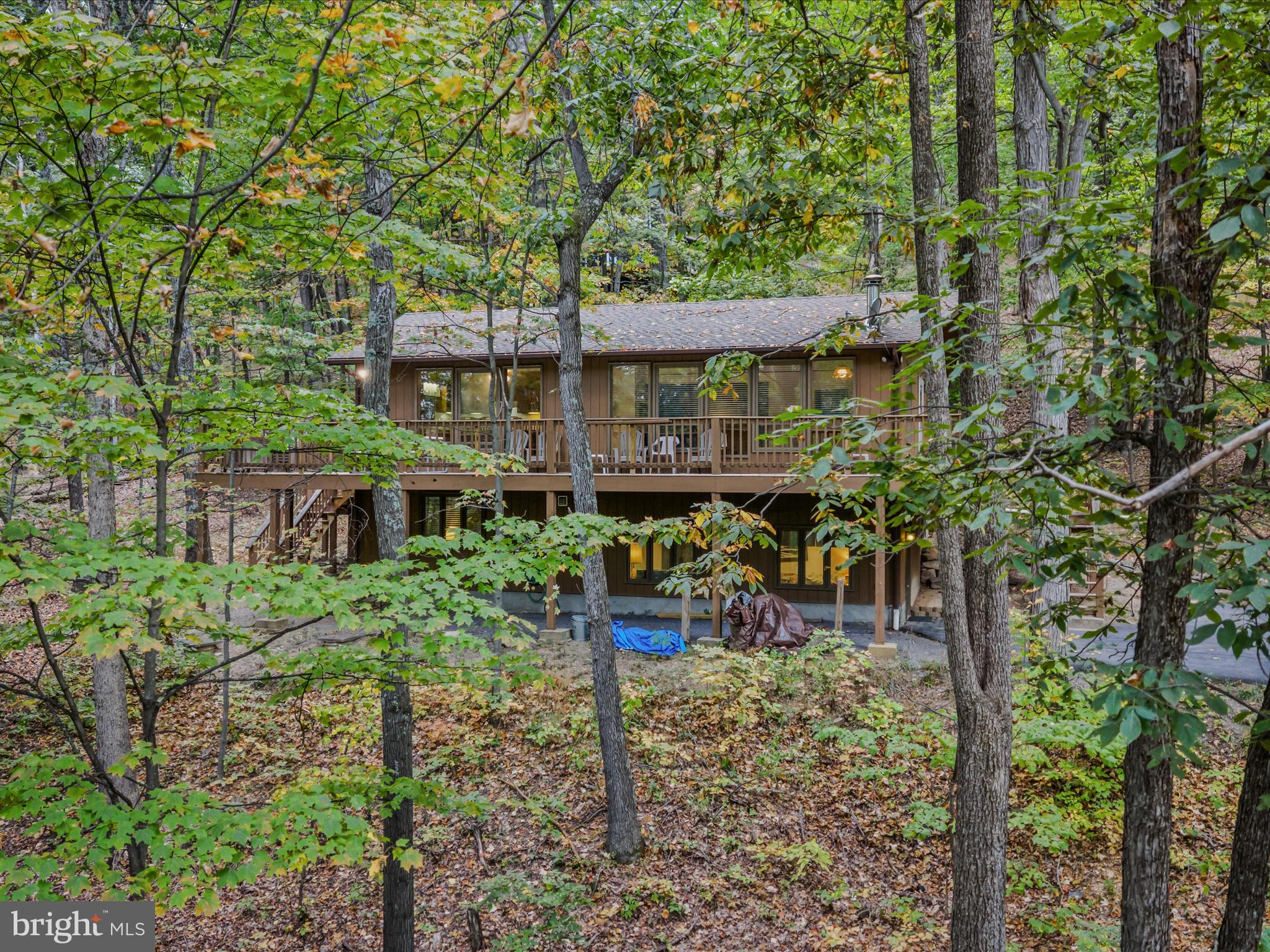 35 Warbler's Way Berkeley Springs, WV 25411 - Photo 37 of 54 front view of a house with a tree