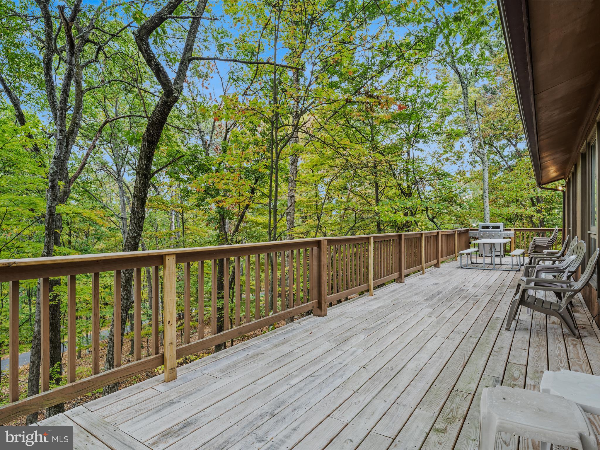 35 Warbler's Way Berkeley Springs, WV 25411 - Photo 6 of 54 a view of balcony with wooden floor and fence