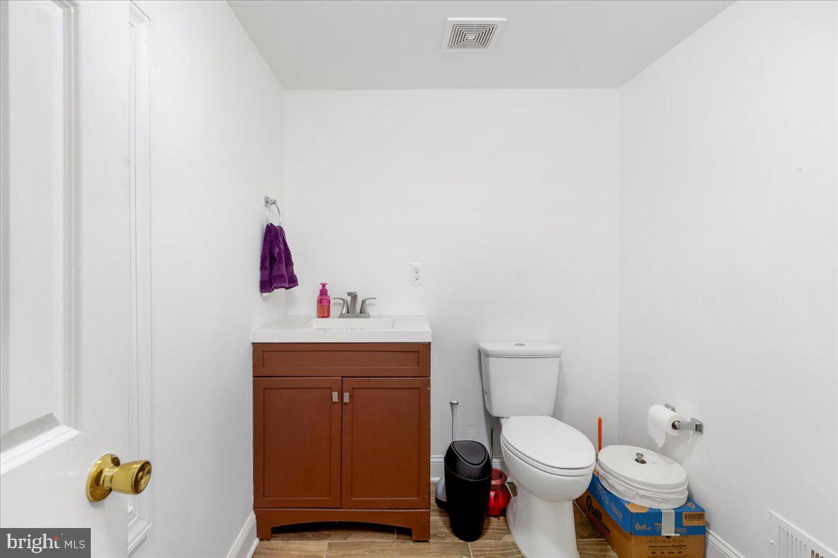 79 Bentonville Road Bentonville, VA 22610 - Photo 12 of 52 a bathroom with a toilet and a sink
