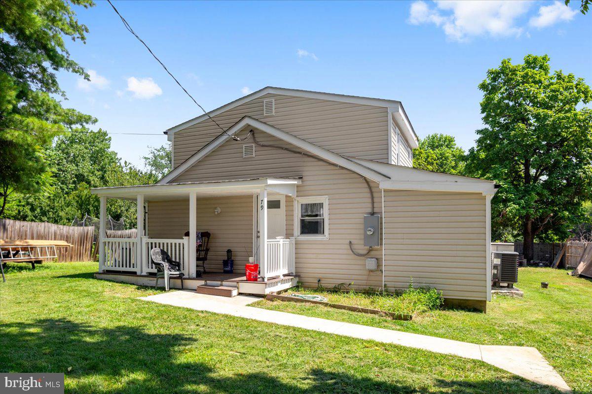 79 Bentonville Road Bentonville, VA 22610 - Photo 2 of 52 a front view of house with yard and outdoor seating