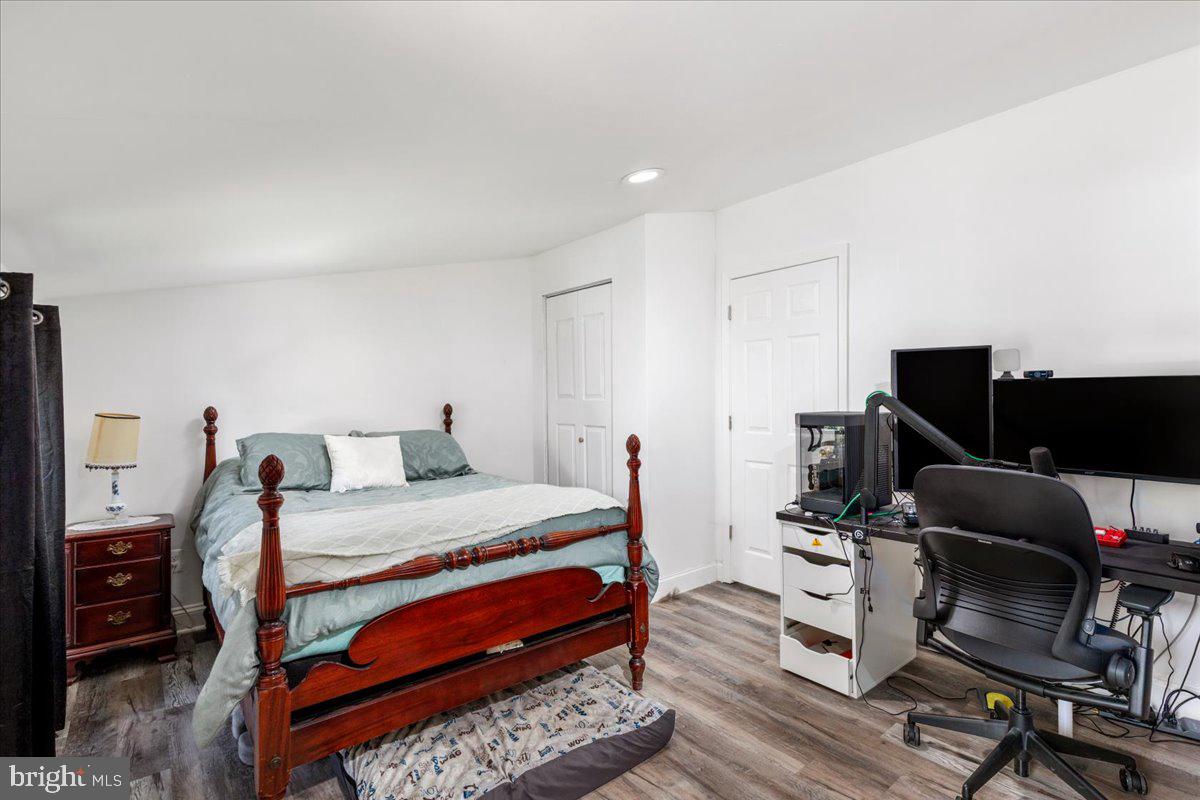 79 Bentonville Road Bentonville, VA 22610 - Photo 21 of 52 a bedroom with a bed and a flat screen tv