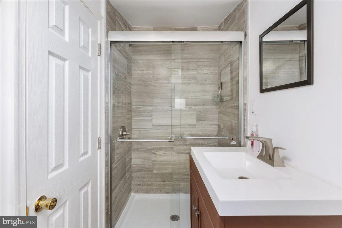 79 Bentonville Road Bentonville, VA 22610 - Photo 26 of 52 a bathroom with a sink and shower