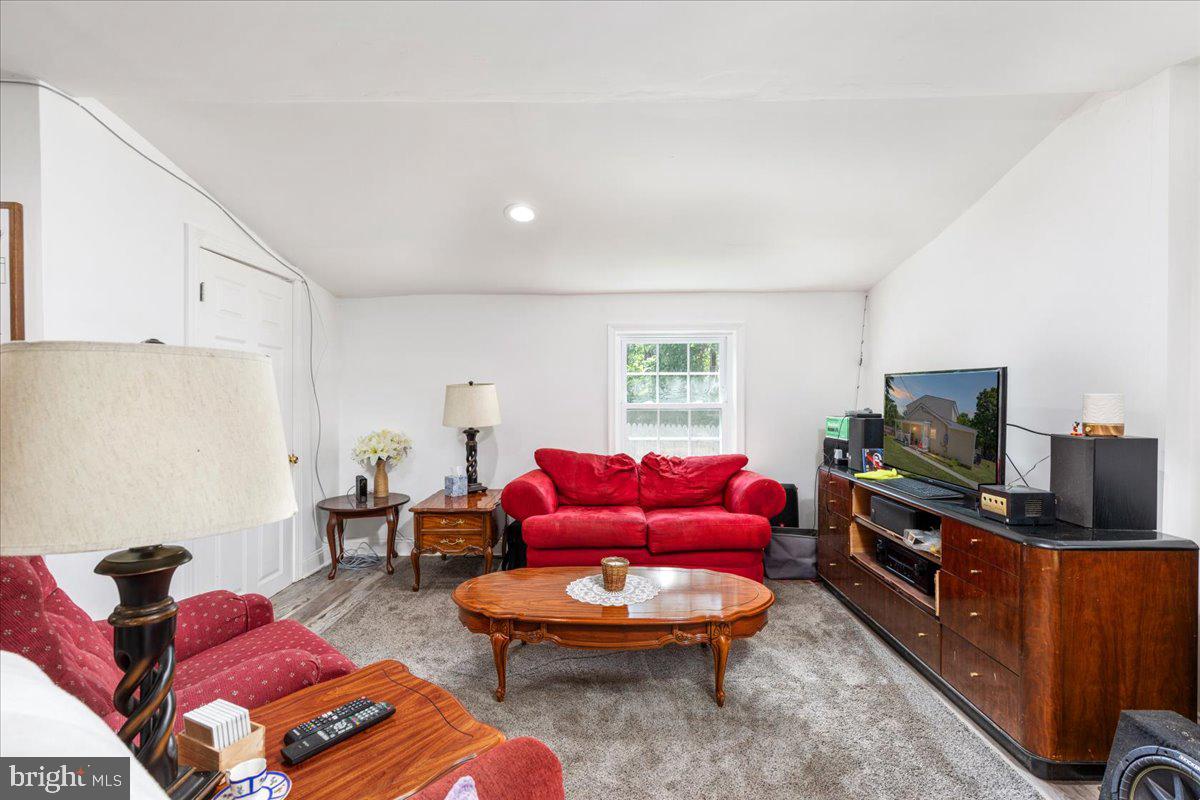 79 Bentonville Road Bentonville, VA 22610 - Photo 5 of 52 a living room with furniture a flat screen tv and a window