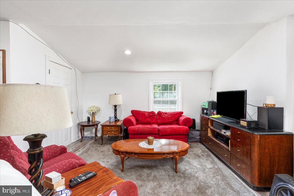 79 Bentonville Road Bentonville, VA 22610 - Photo 6 of 52 a living room with furniture and a flat screen tv
