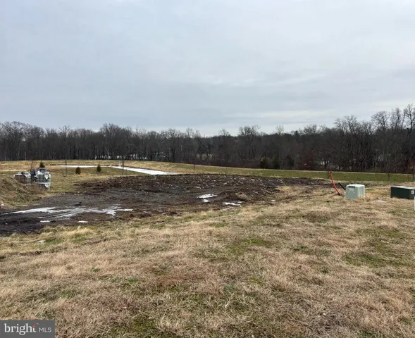 a view of a lake with houses in the back