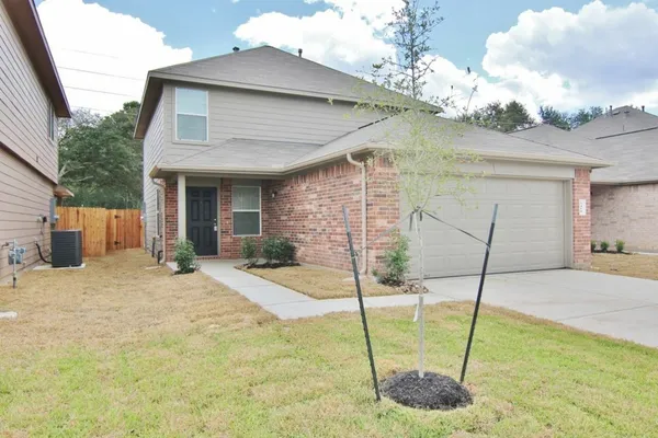 a house view with a backyard space