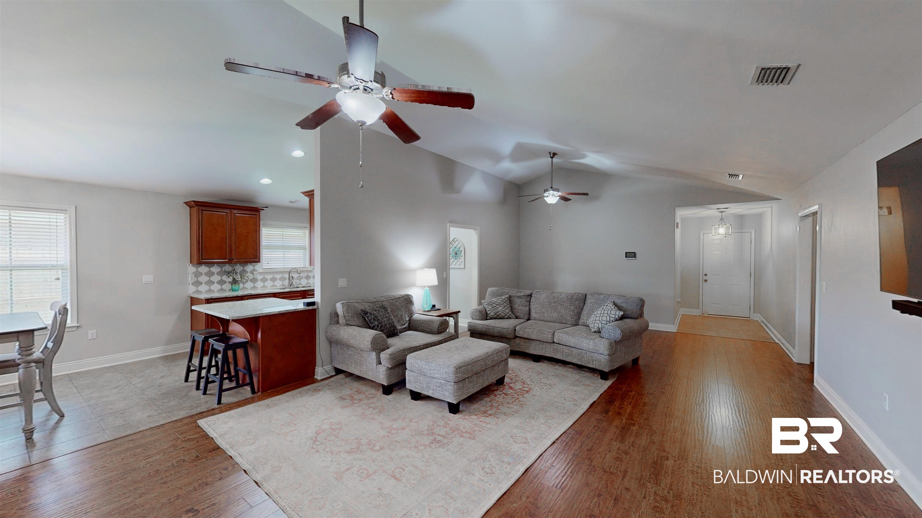 1704 Arcadia Drive Foley, AL 36535 - Photo 17 of 52 Living room with a ceiling fan, healthy amount of natural light, light wood-style flooring, vaulted ceiling, and recessed lighting