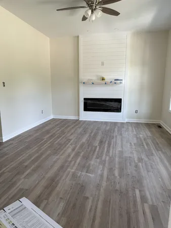 a view of kitchen with cabinets and wooden floor