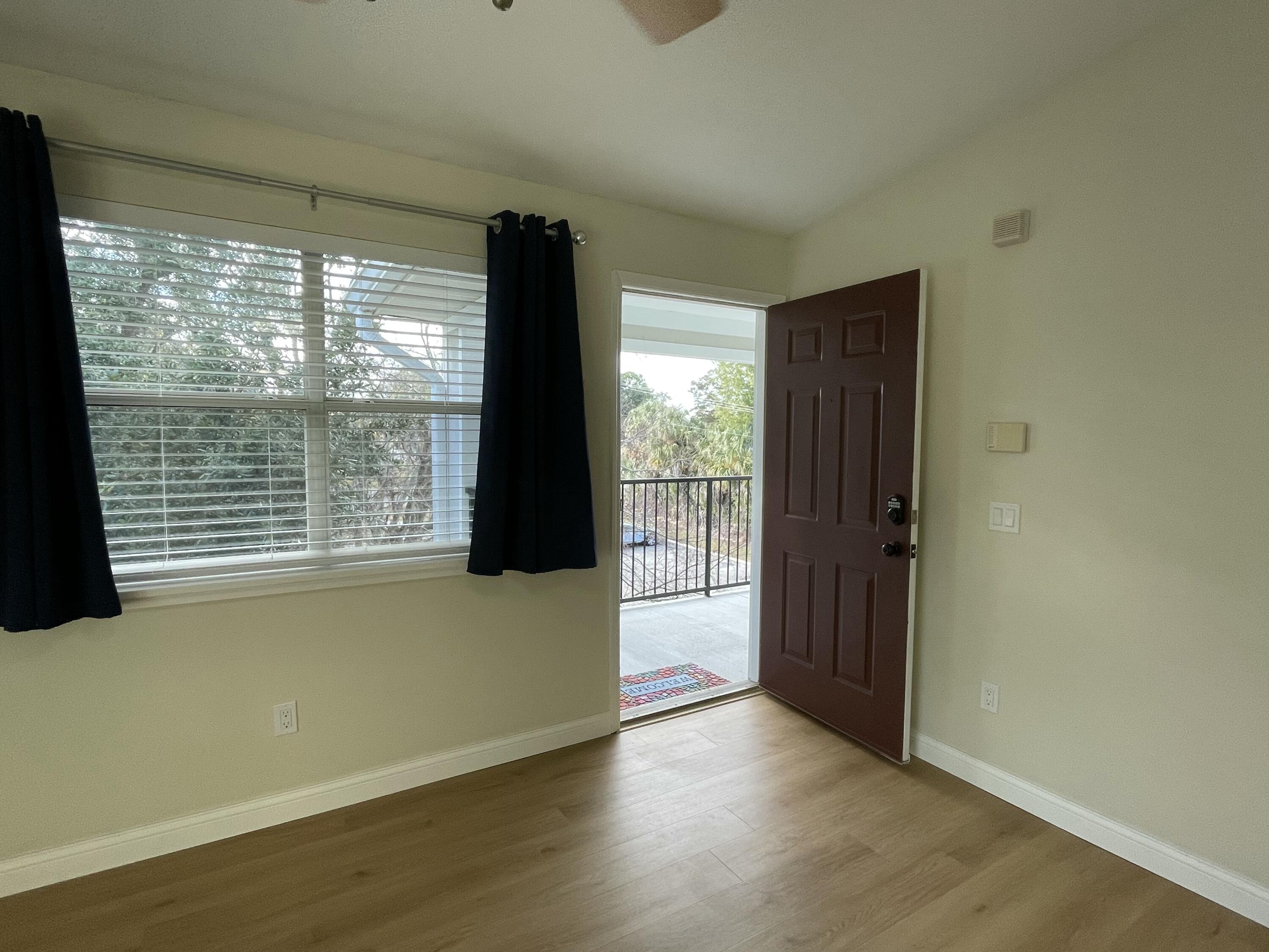 2360 Southwest Archer Road, Unit 1110 Gainesville, FL 32608 - Photo 4 of 25 LR window looks to treed area.