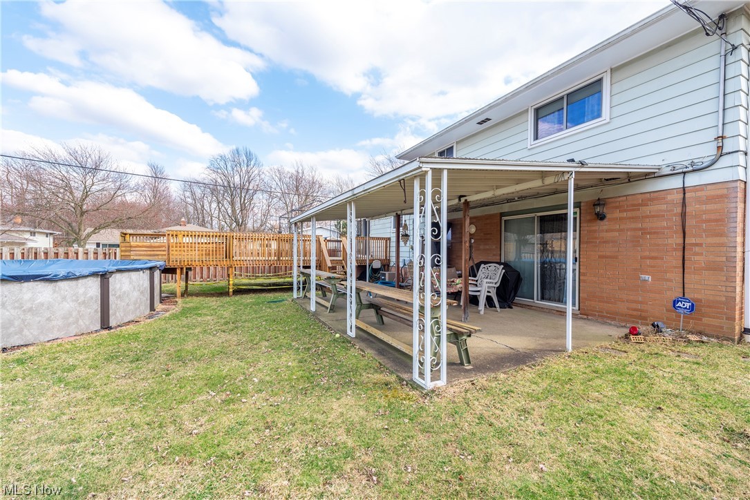 7094 Brandywine Road Parma Heights, OH 44130 - Photo 11 of 49 View of yard with a patio and a covered pool
