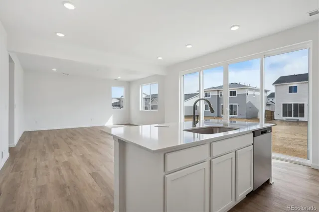 a kitchen with a sink and cabinets