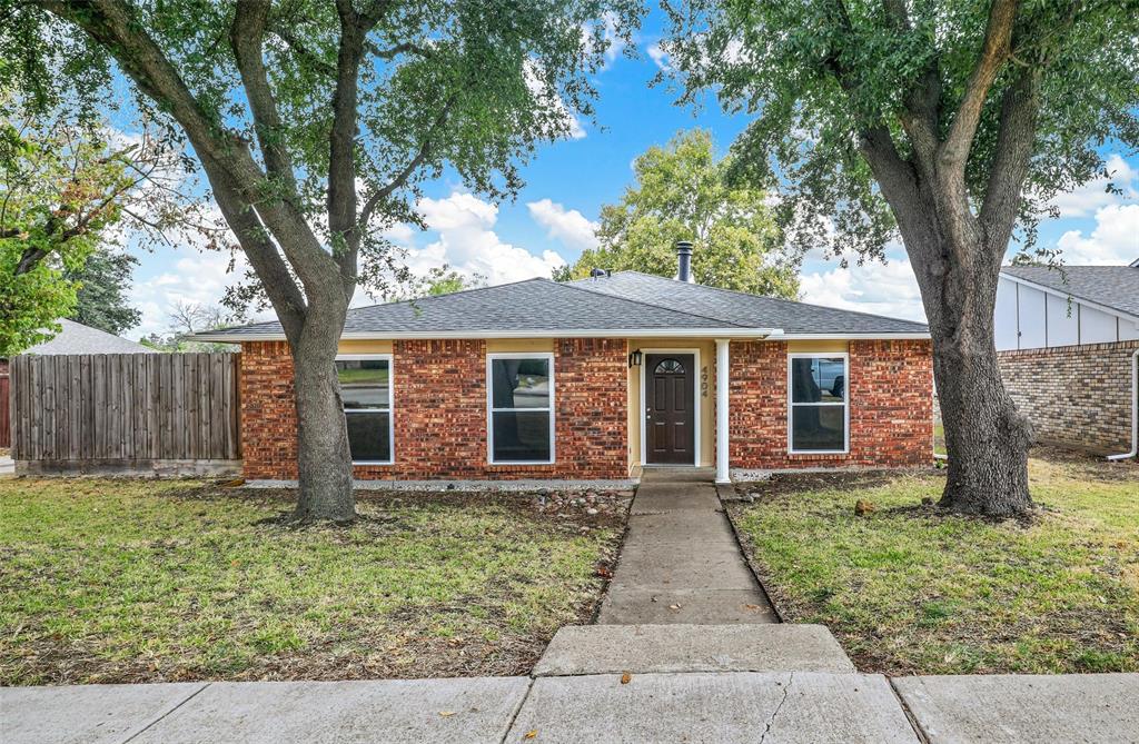 4904 Watkins Drive The Colony, TX 75056 - Photo 1 of 15 front view of a house with a yard