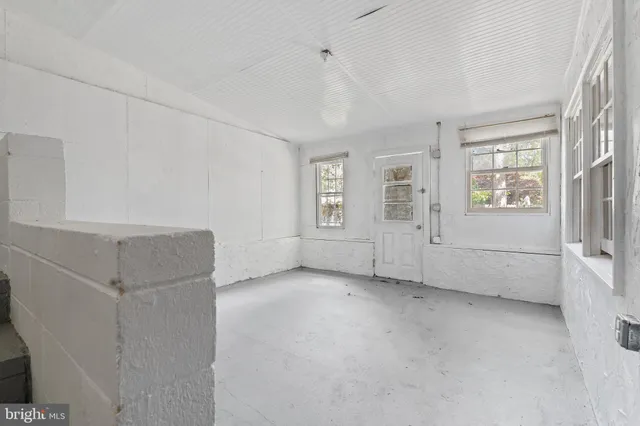 an empty room with windows