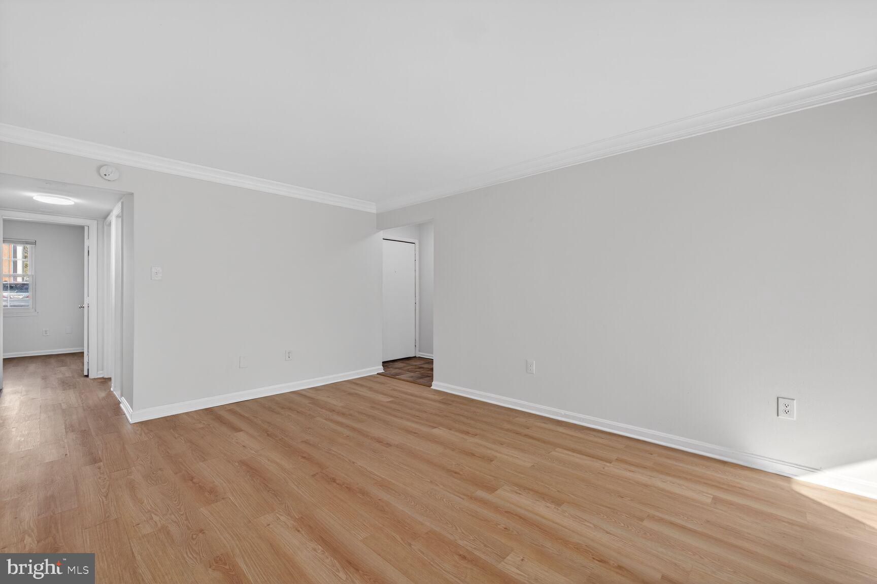 5 Normandy Square Court, Unit 1B Silver Spring, MD 20906 - Photo 4 of 29 Living room - LVT wood flooring