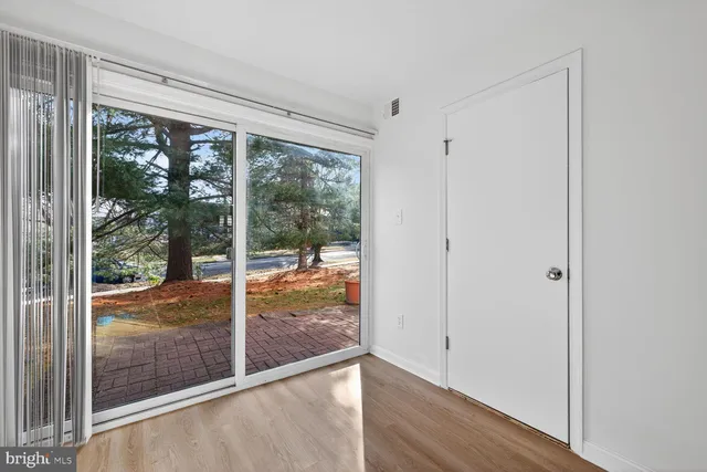 a view of an empty room and window
