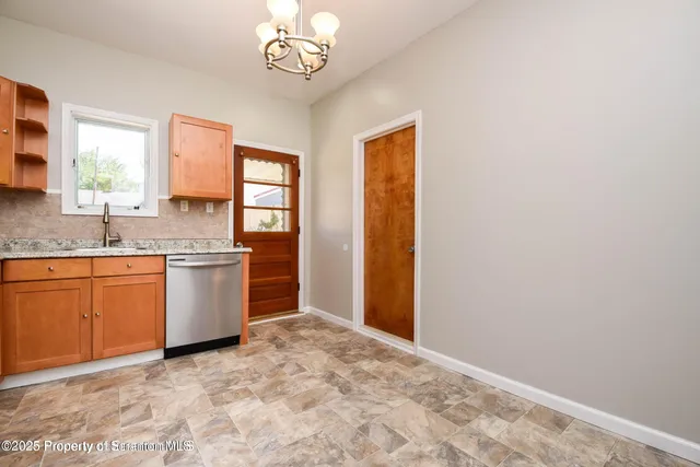 a view of a kitchen with a sink cabinets and a window