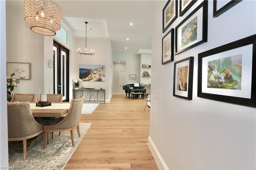 6688 Hunters Road Naples, FL 34109 - Photo 11 of 43 a lobby with furniture and a rug