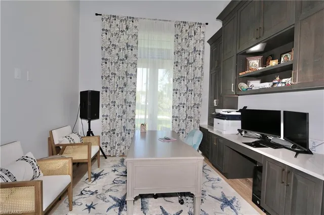 a lobby with furniture and a rug