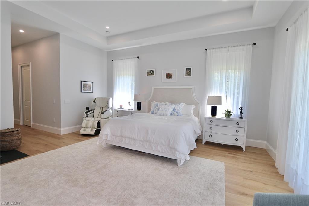 6688 Hunters Road Naples, FL 34109 - Photo 14 of 43 a bedroom with a bed and a window