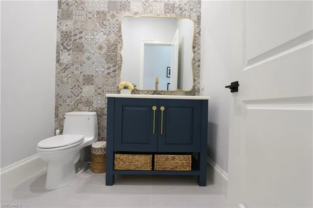 a spacious bathroom with double vanity and a shower