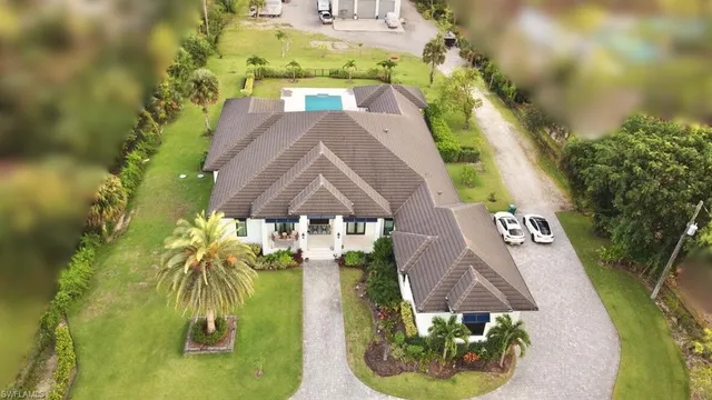 an aerial view of a house with swimming pool