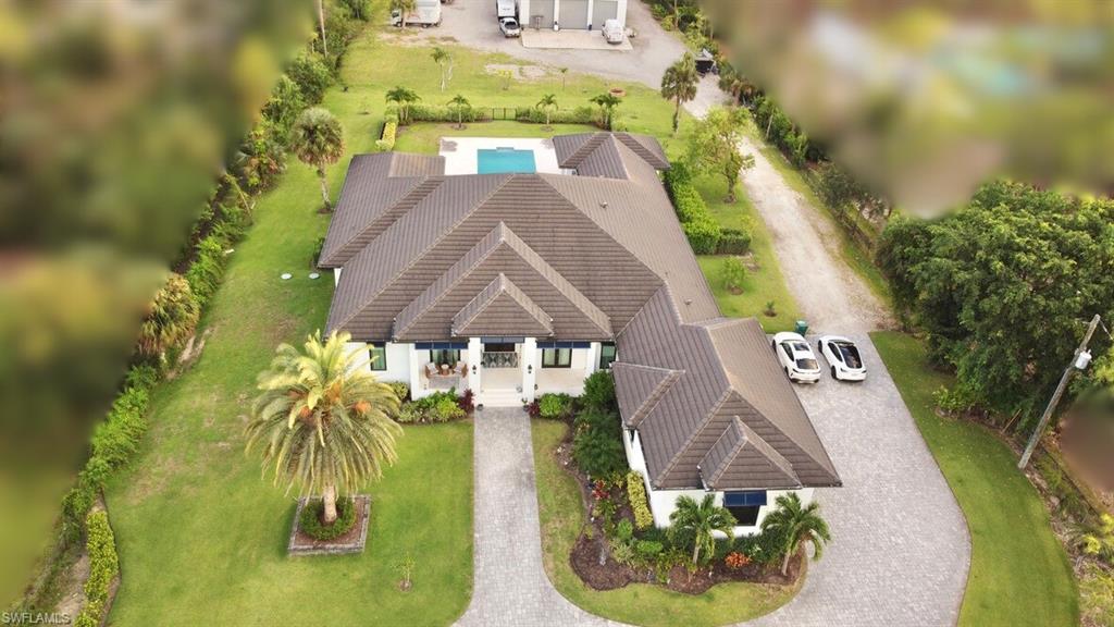 6688 Hunters Road Naples, FL 34109 - Photo 3 of 43 an aerial view of a house with swimming pool