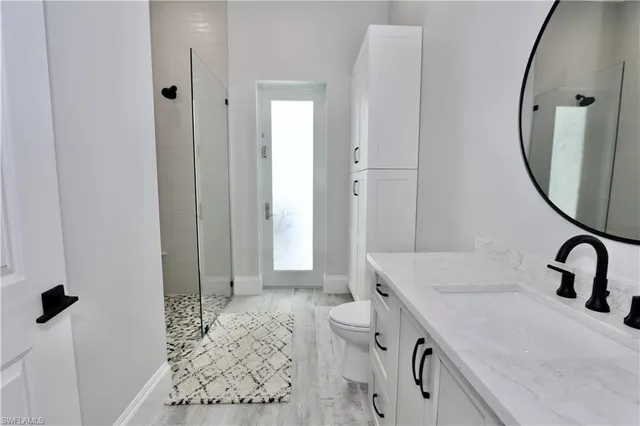 a room with pool table and windows