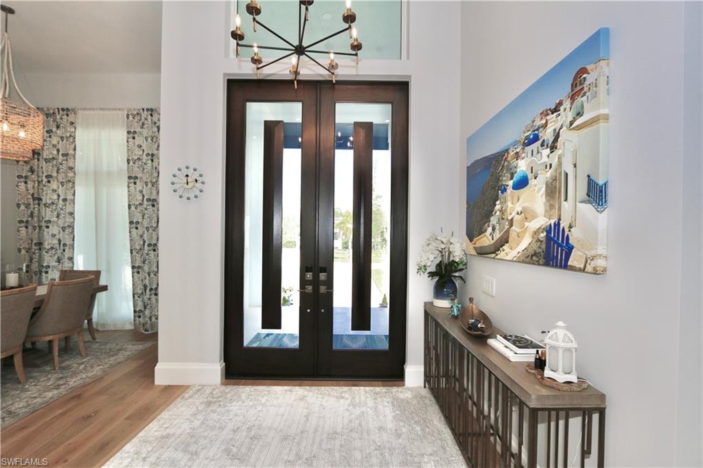 6688 Hunters Road Naples, FL 34109 - Photo 33 of 43 a view of a hallway with workspace