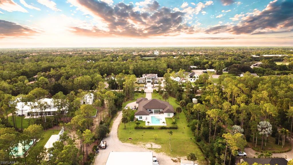 6688 Hunters Road Naples, FL 34109 - Photo 4 of 43 an aerial view of residential houses with yard