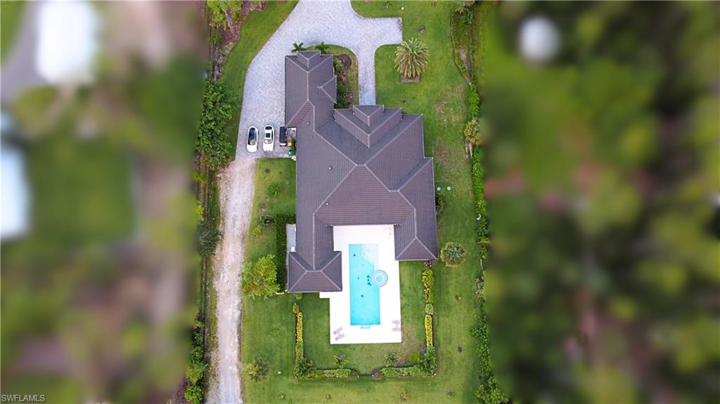 6688 Hunters Road Naples, FL 34109 - Photo 41 of 43 view of a yard