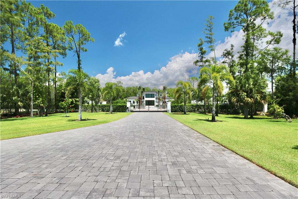 6688 Hunters Road Naples, FL 34109 - Photo 42 of 43 a view of a park with large trees