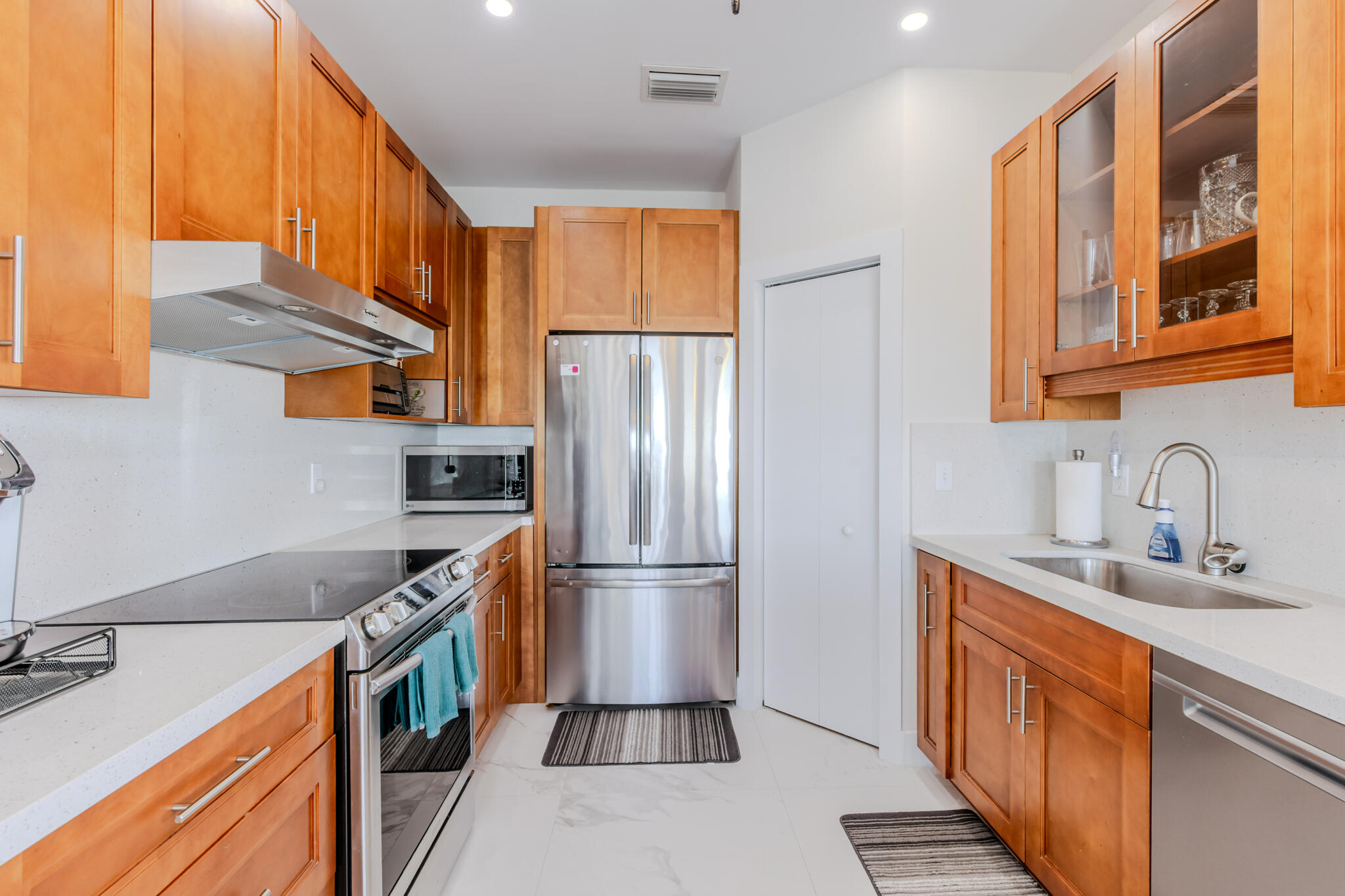 900 85th Street Marathon, FL 33050 - Photo 14 of 48 a kitchen with stainless steel appliances granite countertop a refrigerator and a sink