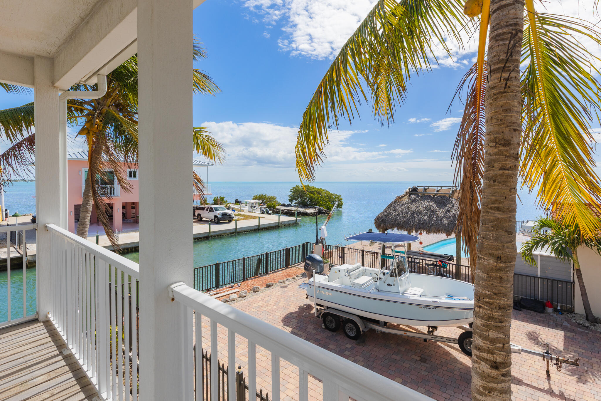 900 85th Street Marathon, FL 33050 - Photo 29 of 48 a balcony with furniture and a potted plant