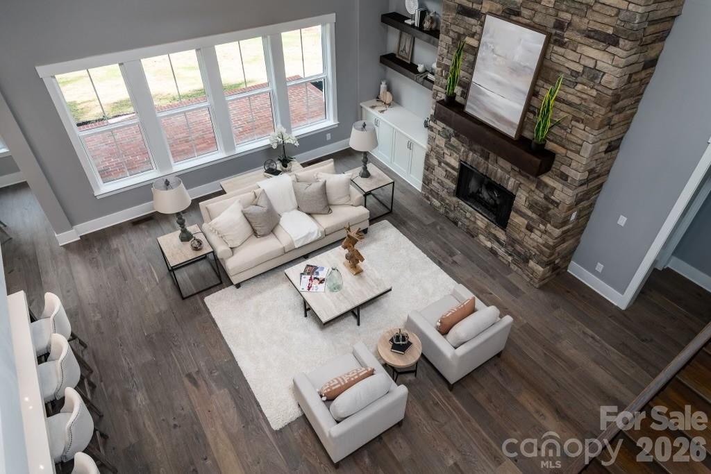 116 Silver Falls Road Troutman, NC 28166 - Photo 15 of 46 a living room with furniture and a fireplace