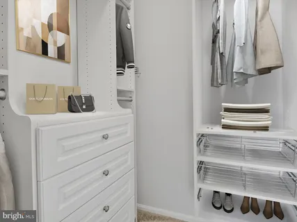 a bedroom with a bed and a chair