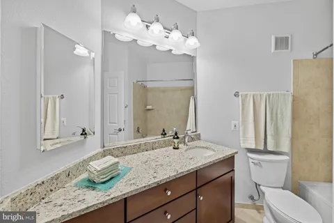 a bedroom with furniture and a bed