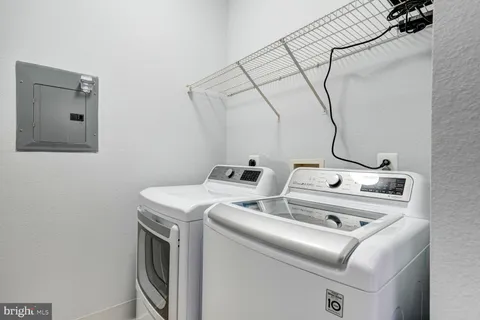 a bathroom with a double vanity sink mirror and shower