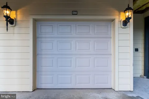 a balcony with table and chairs