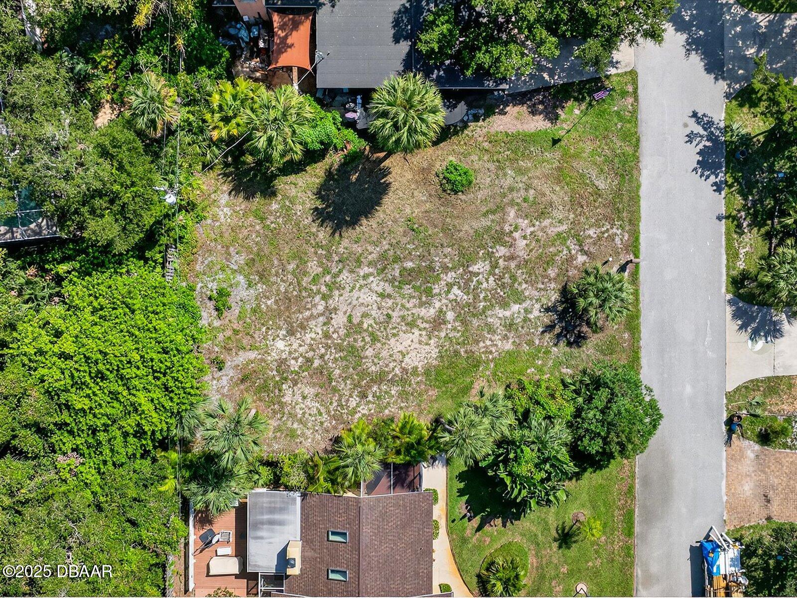 116 Rains Drive Ponce Inlet, FL 32127 - Photo 7 of 14 an aerial view of residential house with outdoor space and trees all around